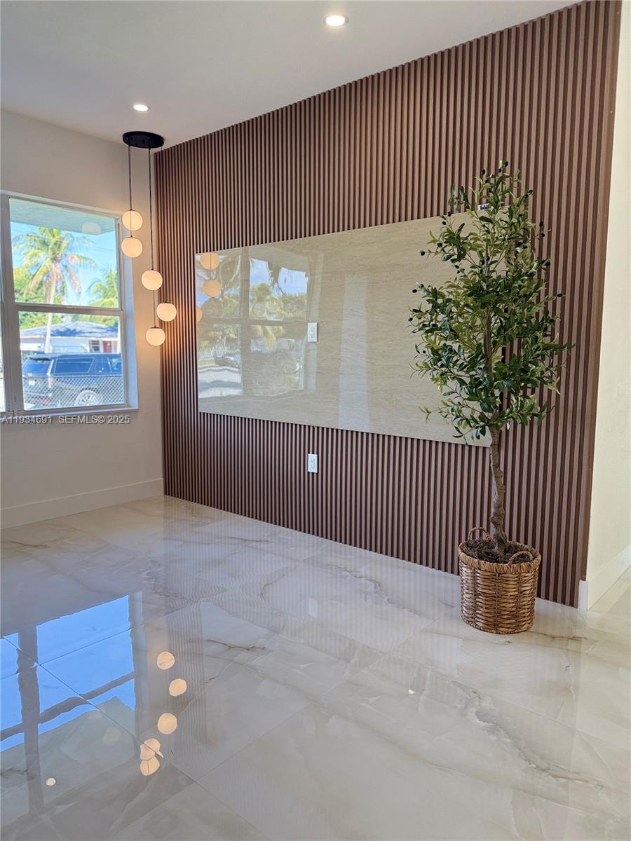 260 Northwest 119th Street Miami, FL 33168 - Photo 11 of 31 a view of a livingroom with a staircase and wooden floor