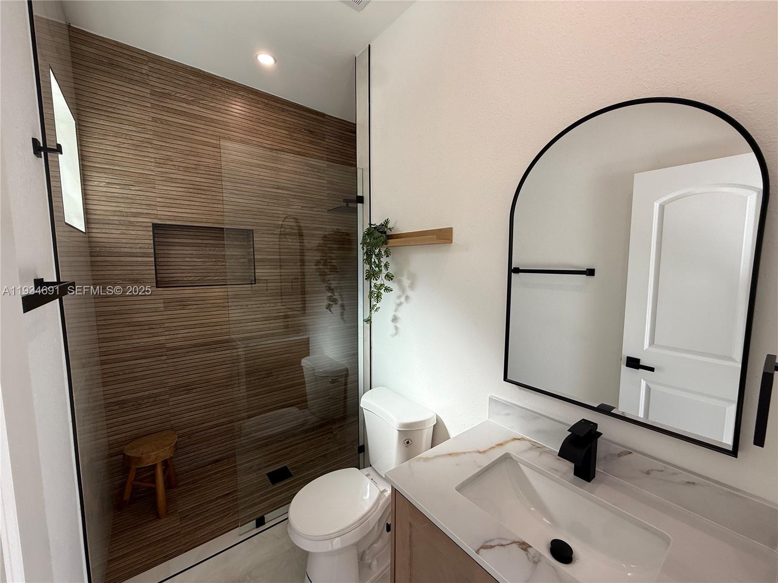 260 Northwest 119th Street Miami, FL 33168 - Photo 19 of 31 a bathroom with a sink toilet and shower