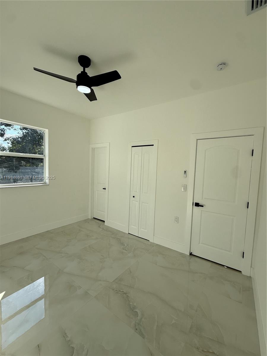 260 Northwest 119th Street Miami, FL 33168 - Photo 24 of 31 a view of a livingroom with a ceiling fan and window
