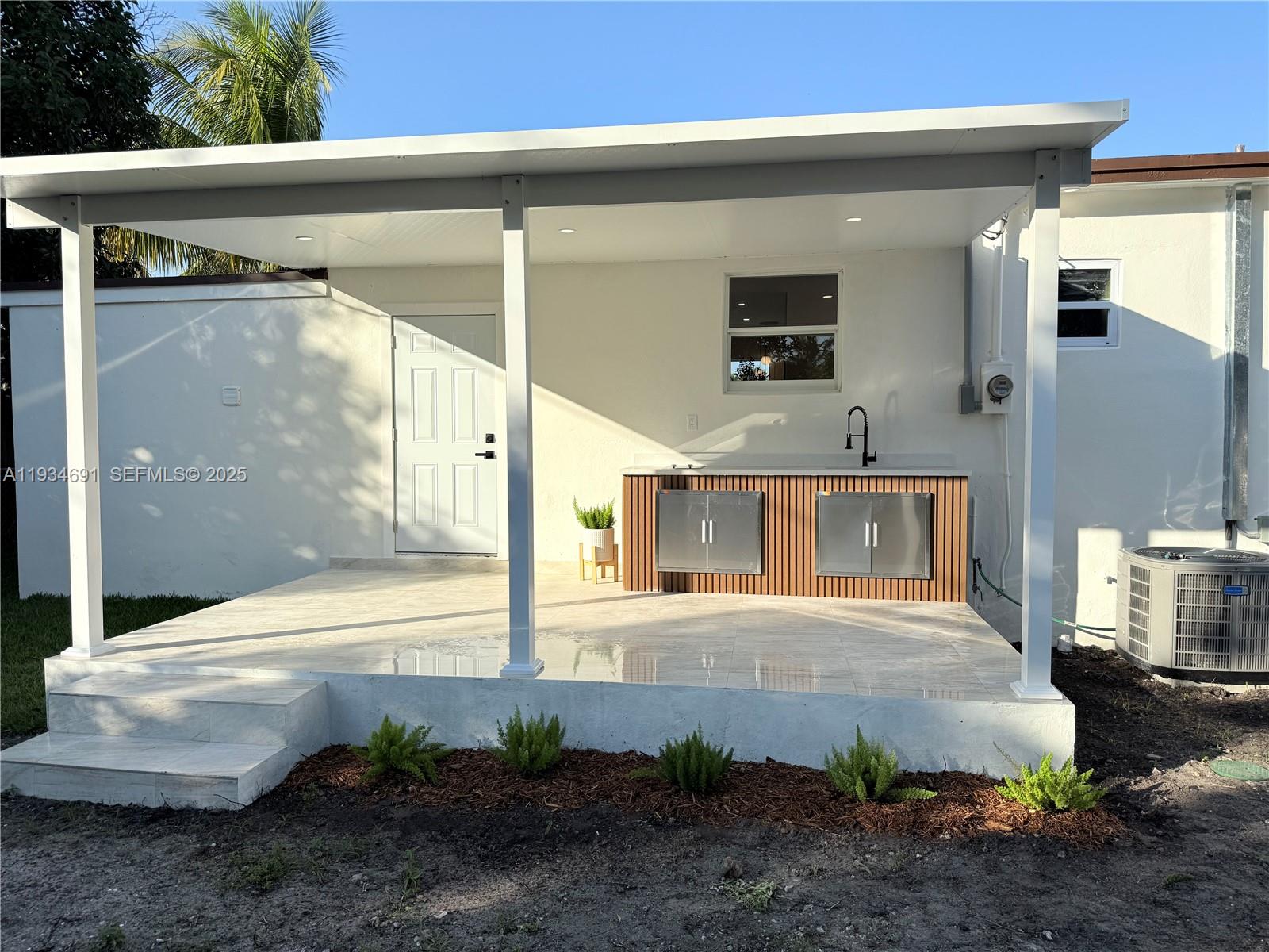 260 Northwest 119th Street Miami, FL 33168 - Photo 29 of 31 a front view of a house with a yard