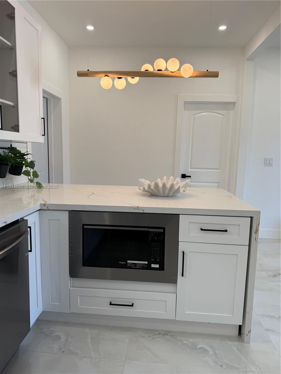 260 Northwest 119th Street Miami, FL 33168 - Photo 5 of 31 a kitchen with a stove and a sink