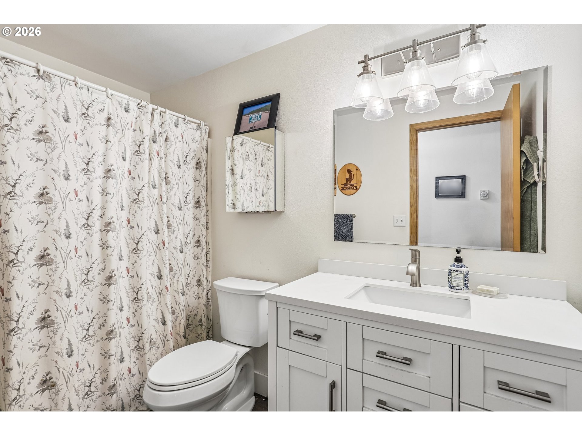 608 Southeast Sumner Street Camas, WA 98607 - Photo 13 of 39 a bathroom with a toilet sink and mirror