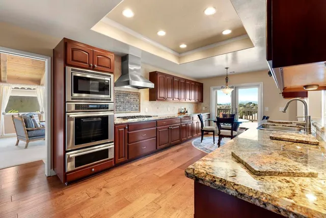 a kitchen with stainless steel appliances a stove and a refrigerator