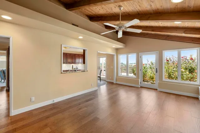 a bedroom with a bed a table and chair