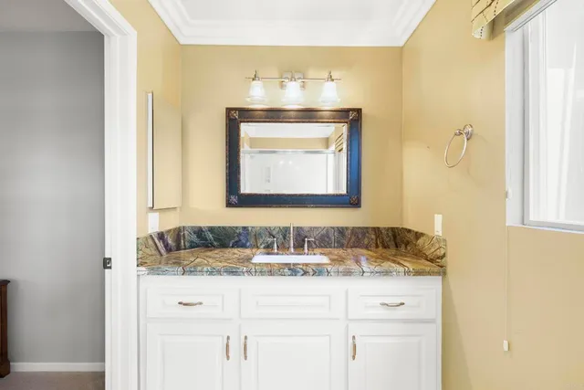 a living room with furniture and a ceiling fan