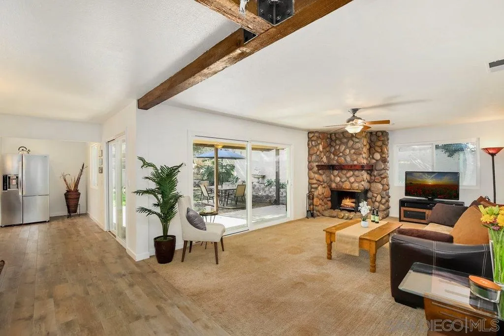 2809 Reed Road Escondido, CA 92027 - Photo 1 of 25 a living room with furniture and a fireplace