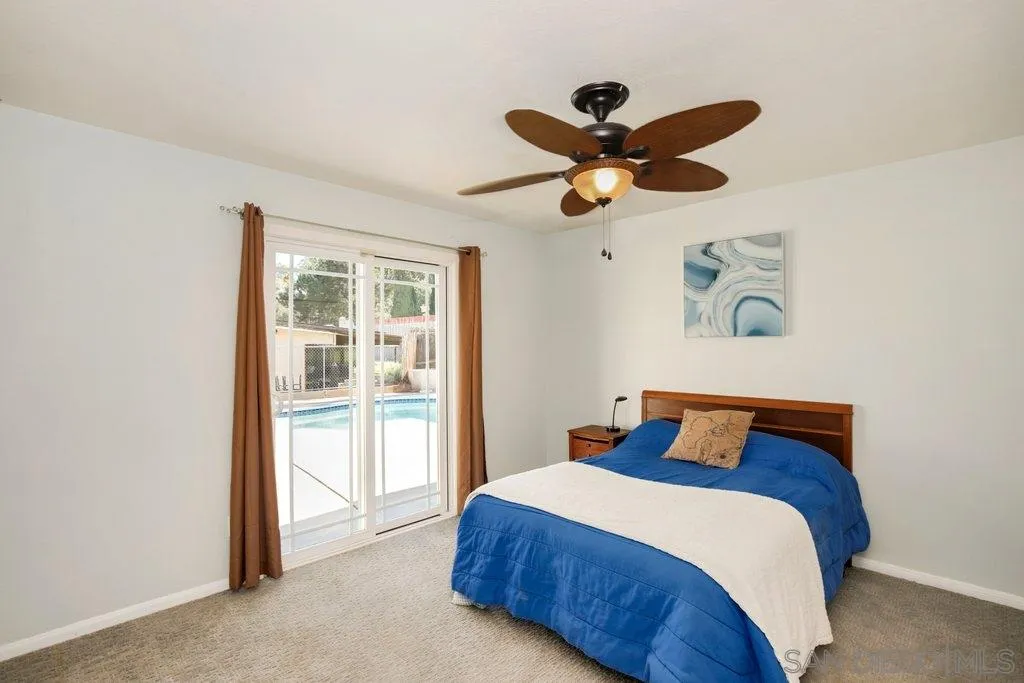 2809 Reed Road Escondido, CA 92027 - Photo 14 of 25 a bedroom with a bed and a painting on the wall