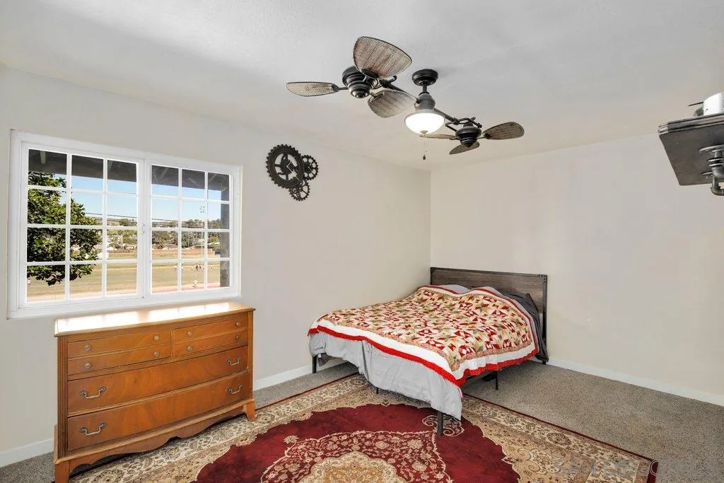 2809 Reed Road Escondido, CA 92027 - Photo 15 of 25 a bedroom with a bed and a window