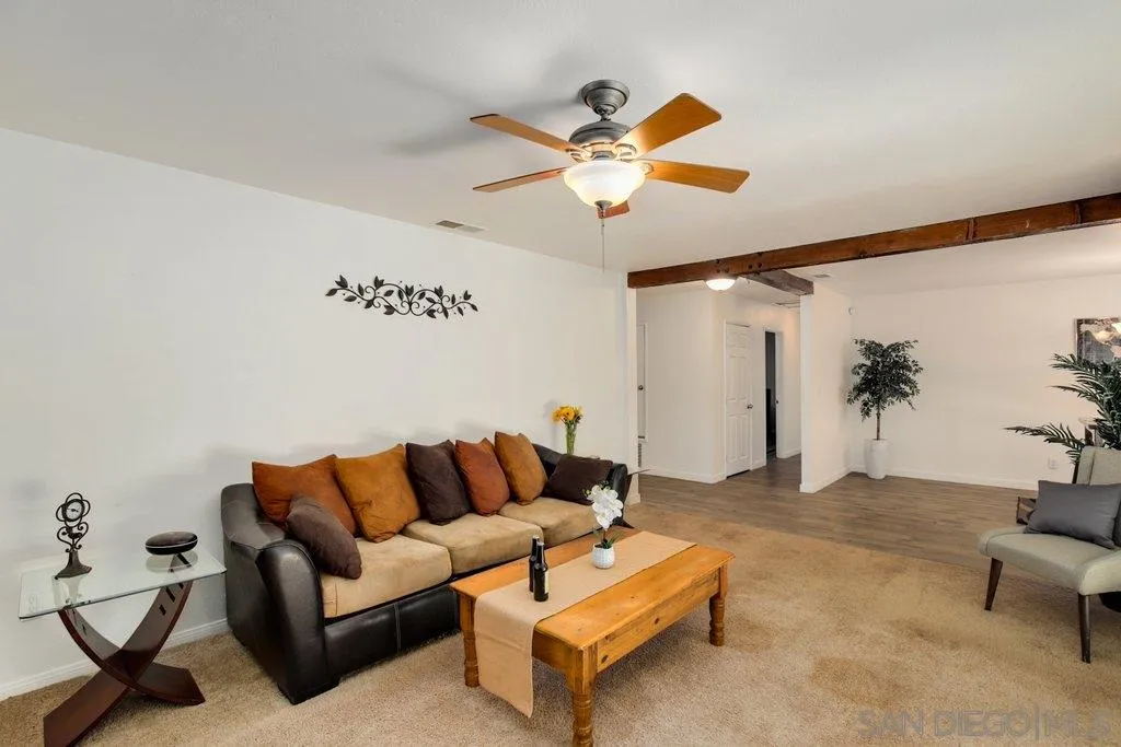 2809 Reed Road Escondido, CA 92027 - Photo 8 of 25 a living room with furniture and a chandelier