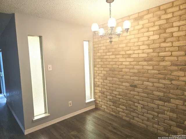 a kitchen with a stove a sink and a refrigerator