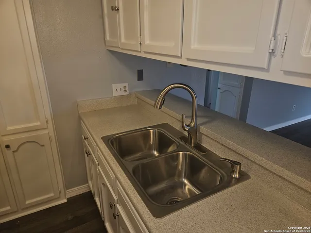 a kitchen with a stove and a microwave