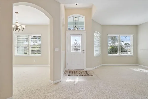 a view of a hallway with closet and bathroom