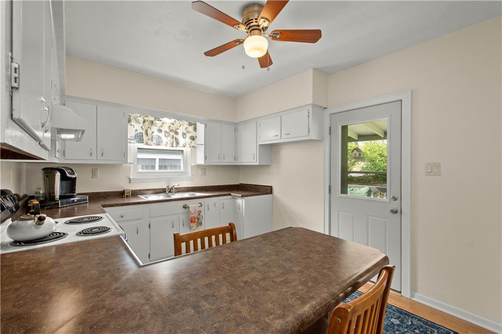 705 Walnut Street Crescent, PA 15046 - Photo 16 of 41 a kitchen with granite countertop a stove a sink dishwasher and a refrigerator