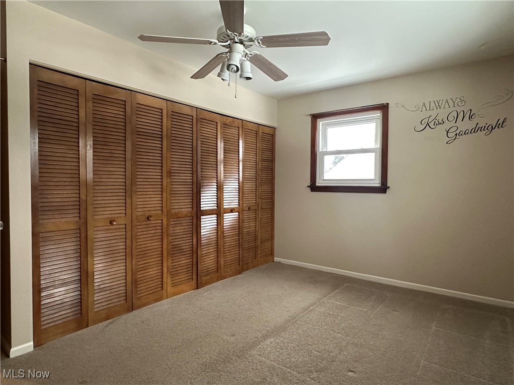 4811 West Pleasant Valley Road Cleveland, OH 44129 - Photo 13 of 31 Unfurnished bedroom with a closet, ceiling fan, and carpet floors