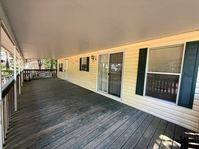 a view of a patio with wooden floor