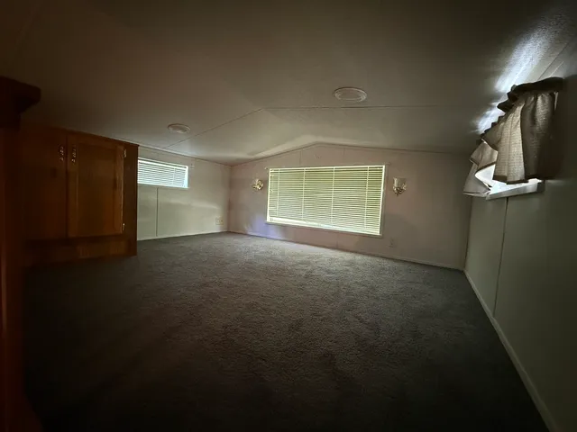 a view of empty room with windows