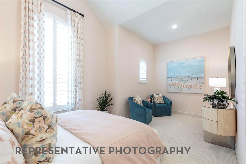 3808 Meander Way Prosper, TX 75078 - Photo 31 of 40 a bedroom with a balcony a bed and a couch