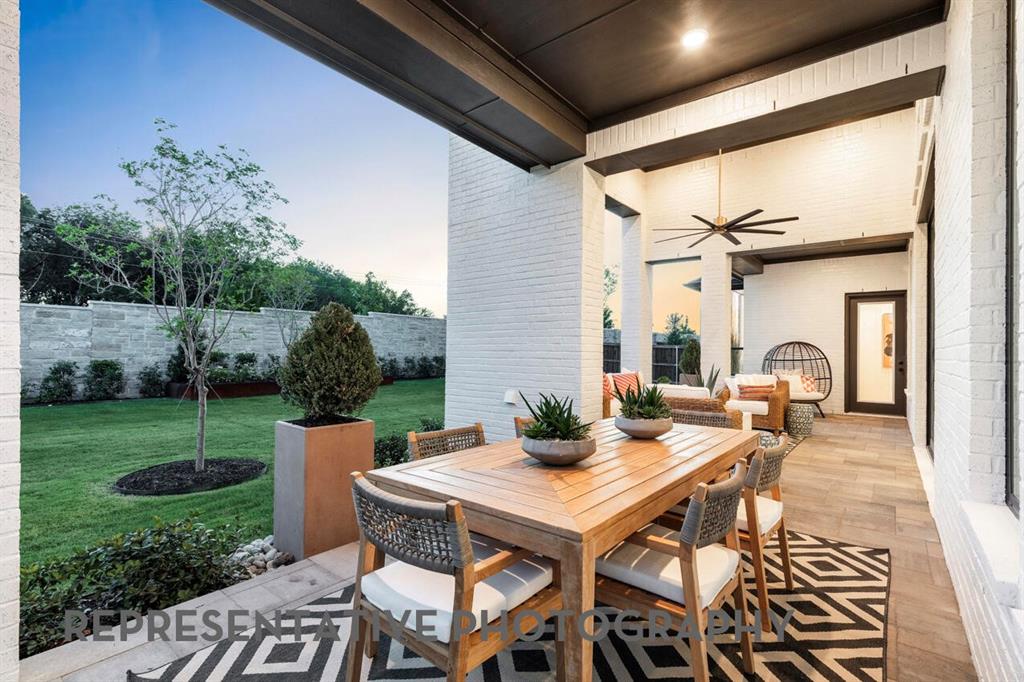 3808 Meander Way Prosper, TX 75078 - Photo 38 of 40 a view of a patio with a table and chairs