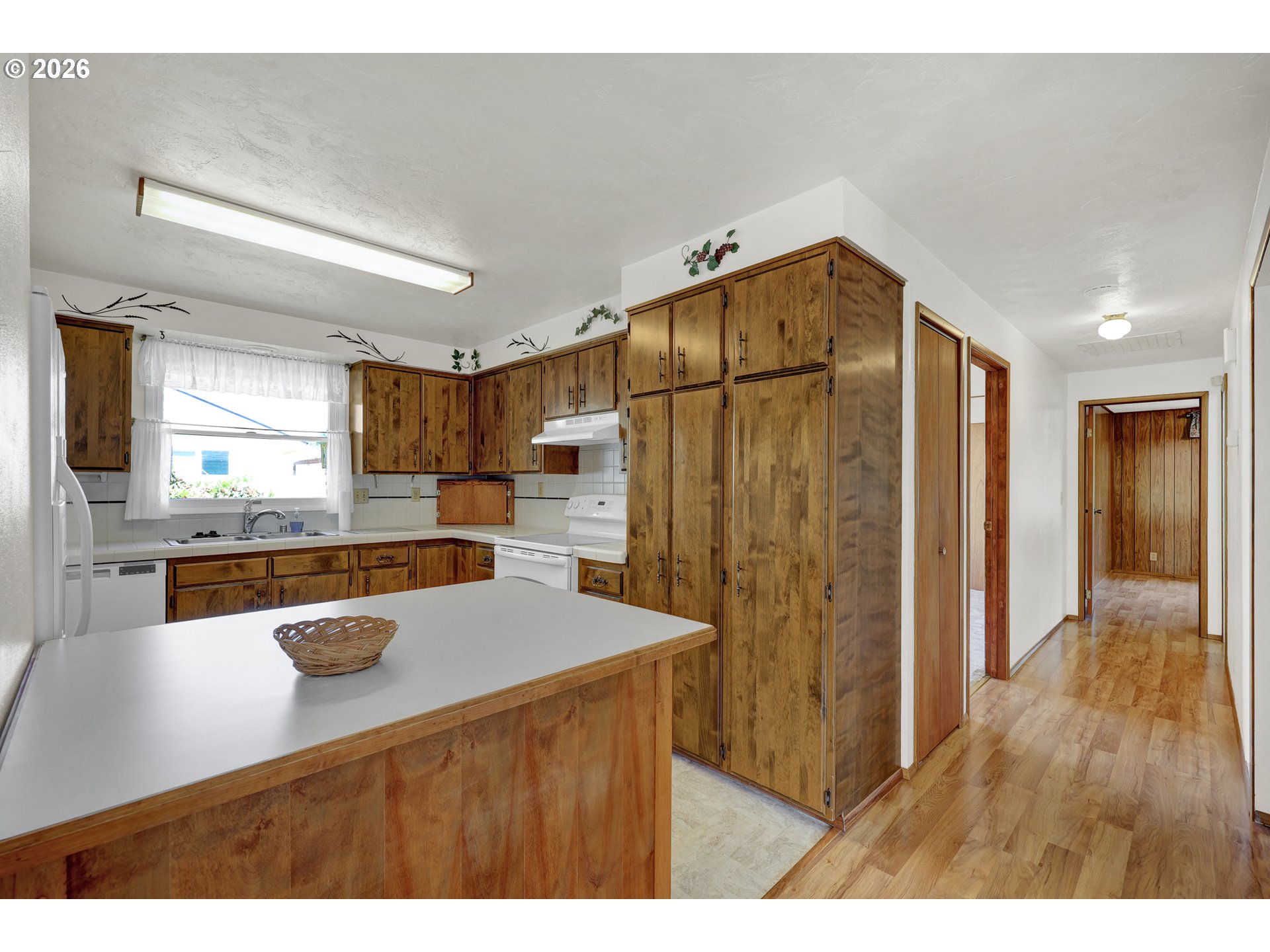 1425 Taney Street Eugene, OR 97402 - Photo 10 of 34 a kitchen with stainless steel appliances granite countertop a refrigerator a sink and a stove