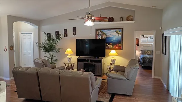 a kitchen with stainless steel appliances granite countertop a sink a refrigerator and a stove