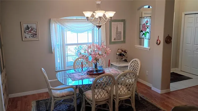 a kitchen with stainless steel appliances granite countertop a sink and a stove