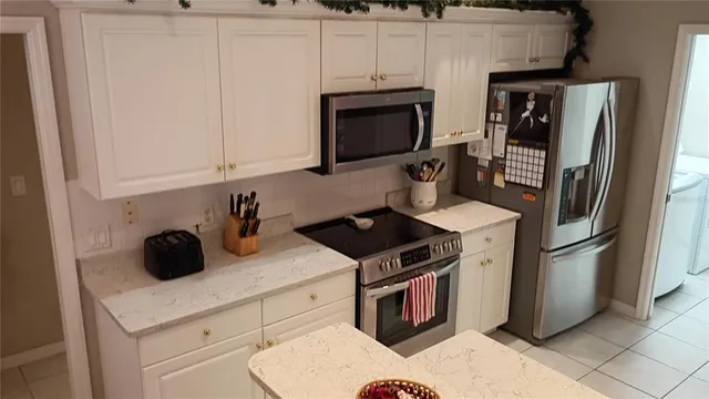a view of a dining room with furniture and a window