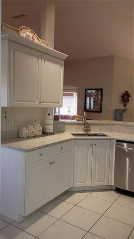 a view of a livingroom with furniture and flat screen tv