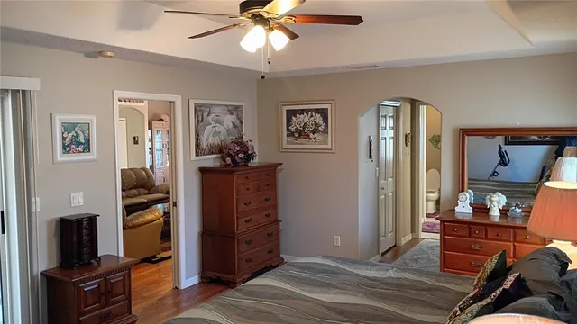 a bathroom with a toilet and a shower curtain
