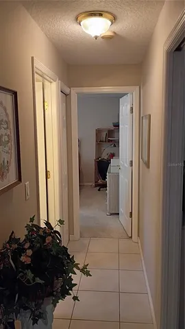 a view of a house with backyard space and porch