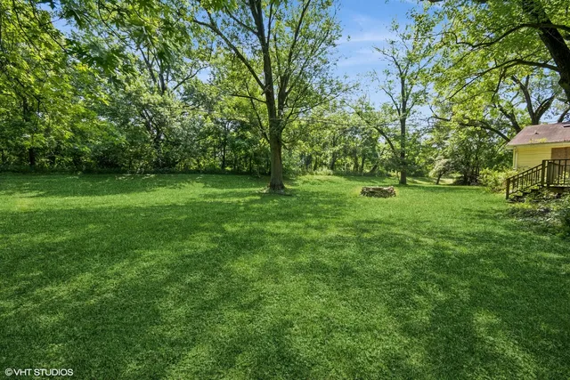 a view of field with trees in the background