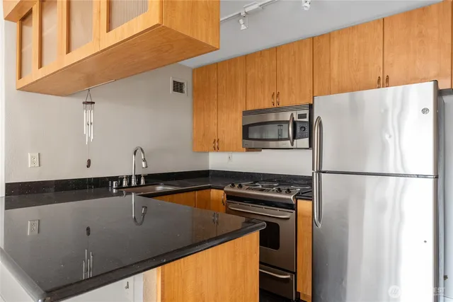 a white refrigerator freezer sitting inside of a kitchen