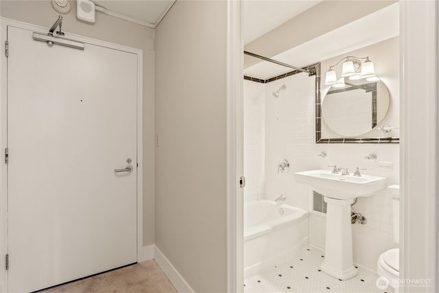 a bathroom with a sink a mirror and shower