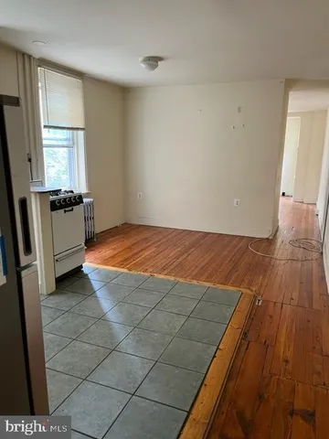 a view of a kitchen with a sink and a stove top oven
