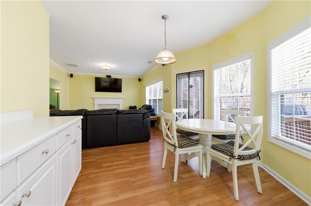 5980 Giles Road Lithonia, GA 30058 - Photo 14 of 38 a view of a dining room with furniture window and wooden floor