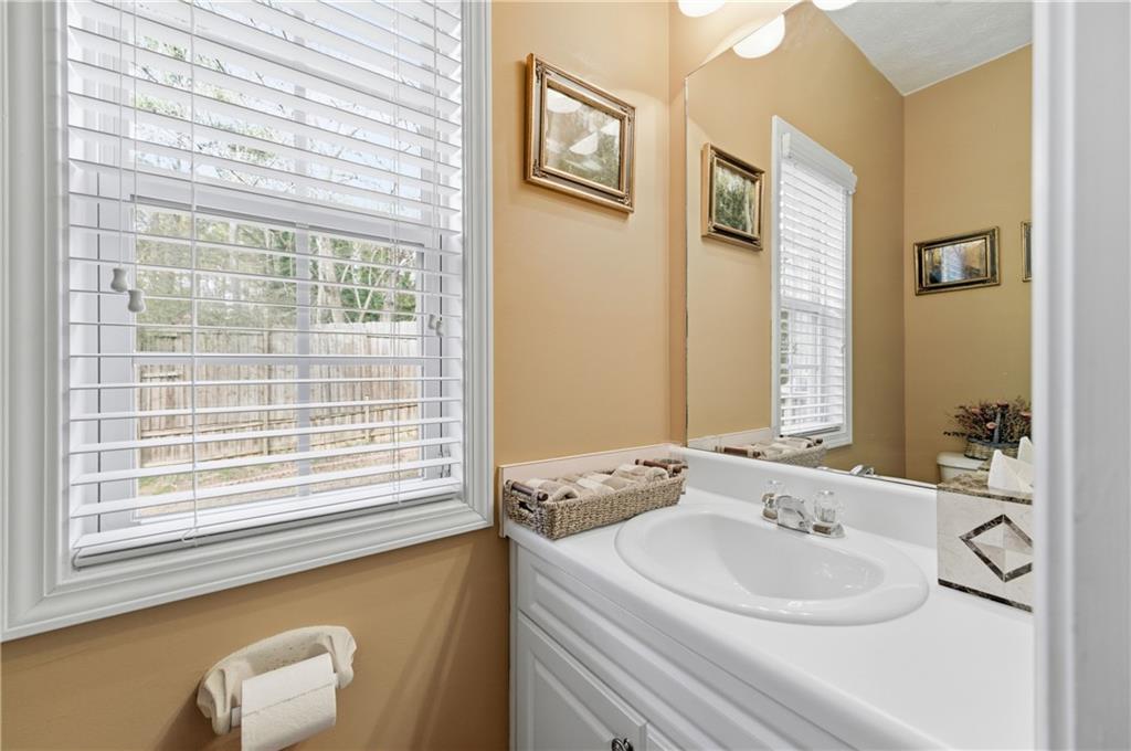 5980 Giles Road Lithonia, GA 30058 - Photo 15 of 38 a bathroom with a sink and a mirror