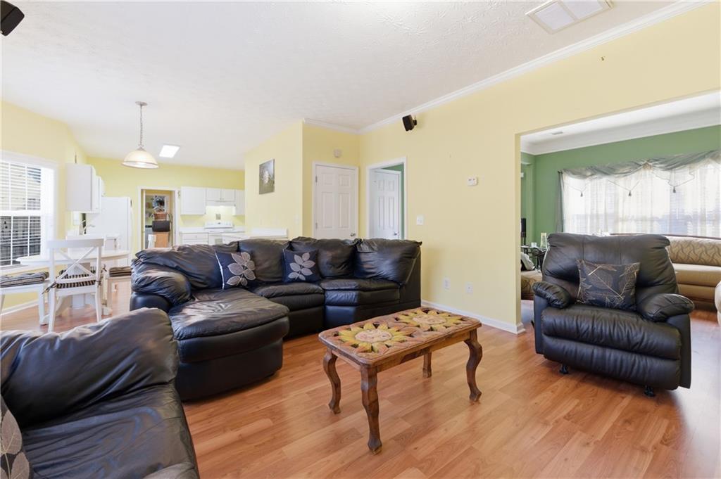 5980 Giles Road Lithonia, GA 30058 - Photo 18 of 38 a living room with furniture and a large window