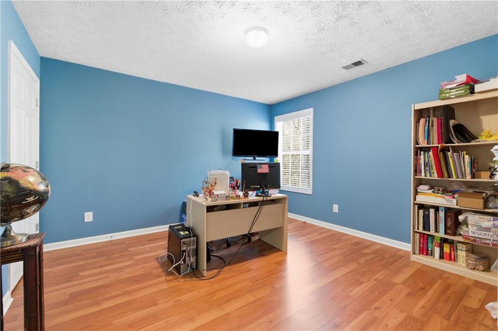 5980 Giles Road Lithonia, GA 30058 - Photo 22 of 38 a workspace with furniture bookshelf and a window