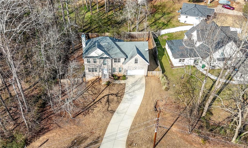 5980 Giles Road Lithonia, GA 30058 - Photo 35 of 38 a view of a house with a yard