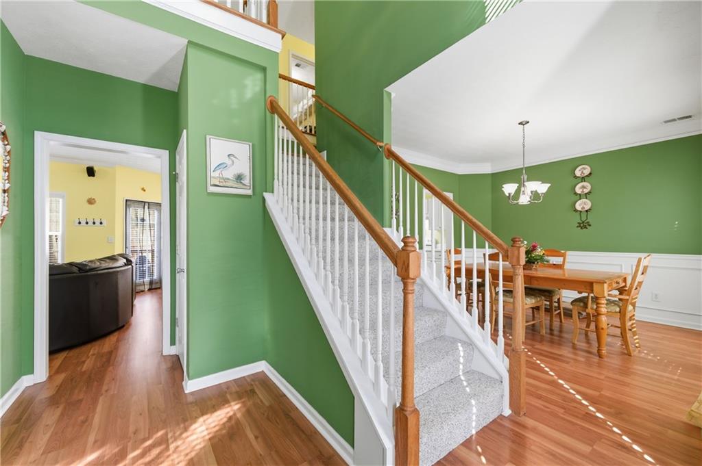 5980 Giles Road Lithonia, GA 30058 - Photo 7 of 38 a view of entryway and hall with wooden floor