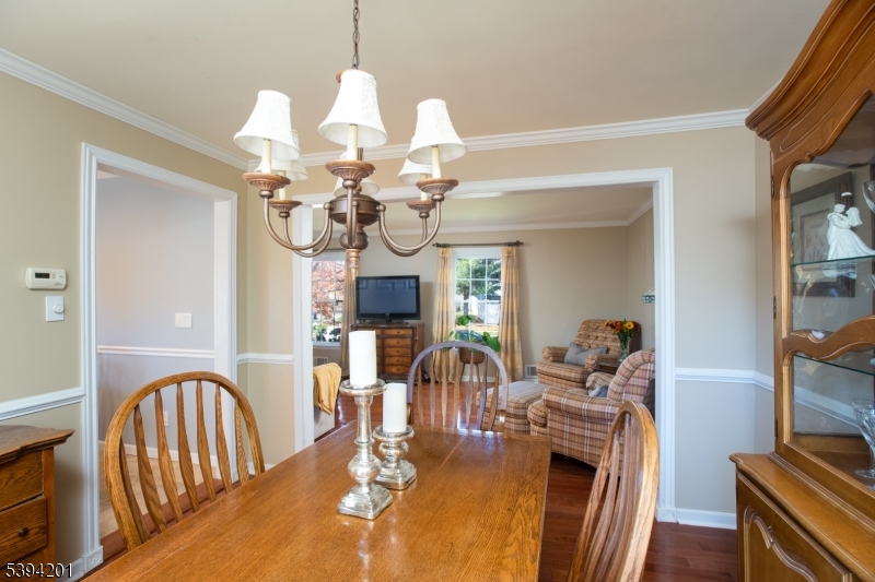 4 Marshall Road Hillsborough, NJ 08844 - Photo 13 of 38 a view of a dining room with furniture a chandelier and wooden floor