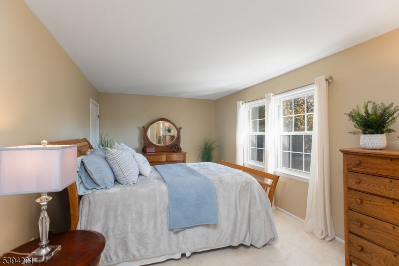 4 Marshall Road Hillsborough, NJ 08844 - Photo 15 of 38 a bedroom with a bed and a window