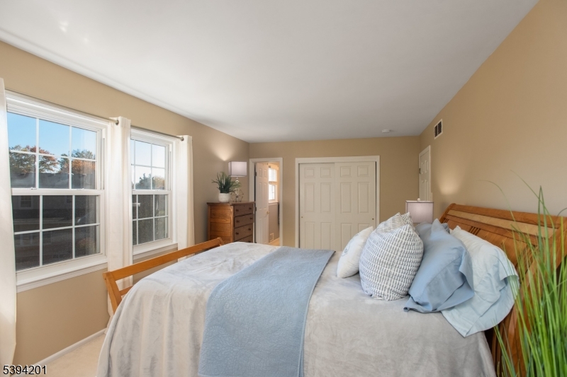 4 Marshall Road Hillsborough, NJ 08844 - Photo 16 of 38 a bedroom with a large bed and a large window
