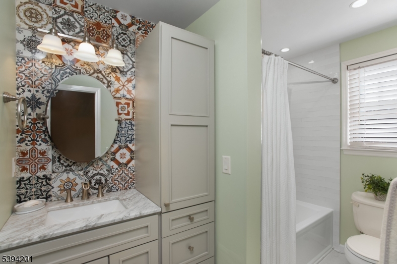 4 Marshall Road Hillsborough, NJ 08844 - Photo 7 of 38 a bathroom with a toilet and a sink