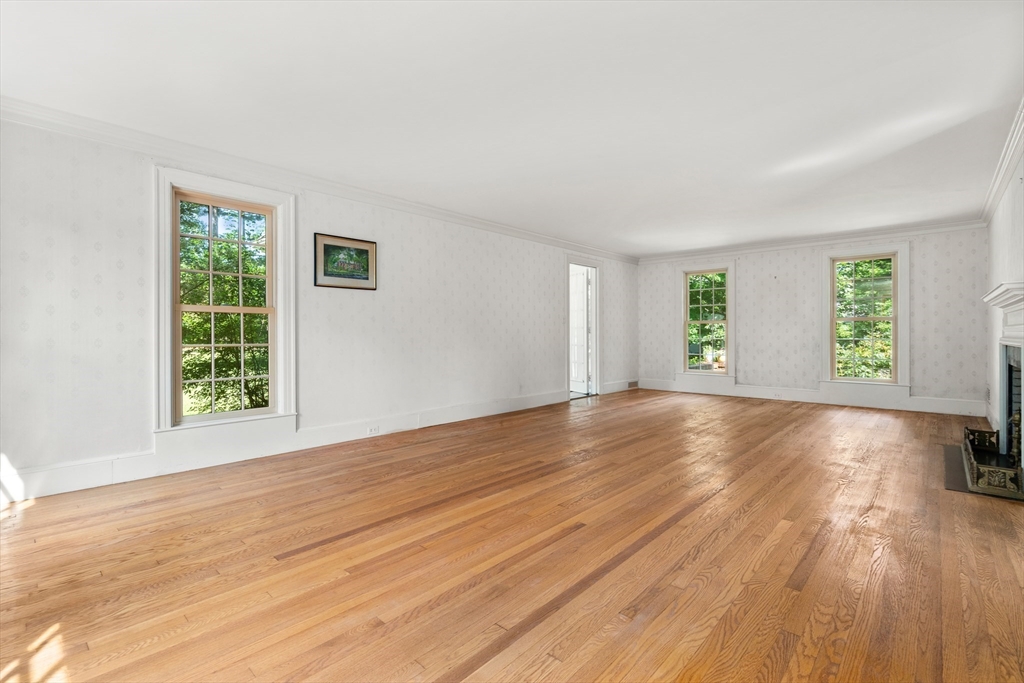 2 Kenilworth Road Wellesley, MA 02482 - Photo 11 of 41 a view of empty room with wooden floor and fan