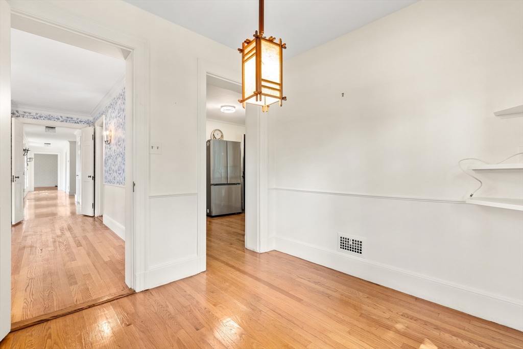 2 Kenilworth Road Wellesley, MA 02482 - Photo 18 of 41 a view of a hallway with wooden floor