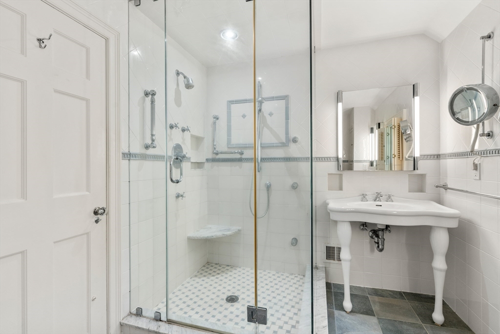 2 Kenilworth Road Wellesley, MA 02482 - Photo 24 of 41 a bathroom with a shower sink and mirror