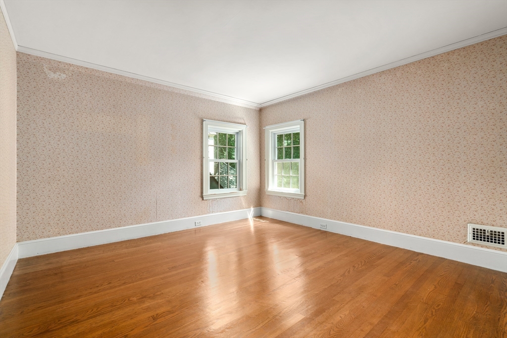 2 Kenilworth Road Wellesley, MA 02482 - Photo 27 of 41 a view of an empty room with wooden floor and window
