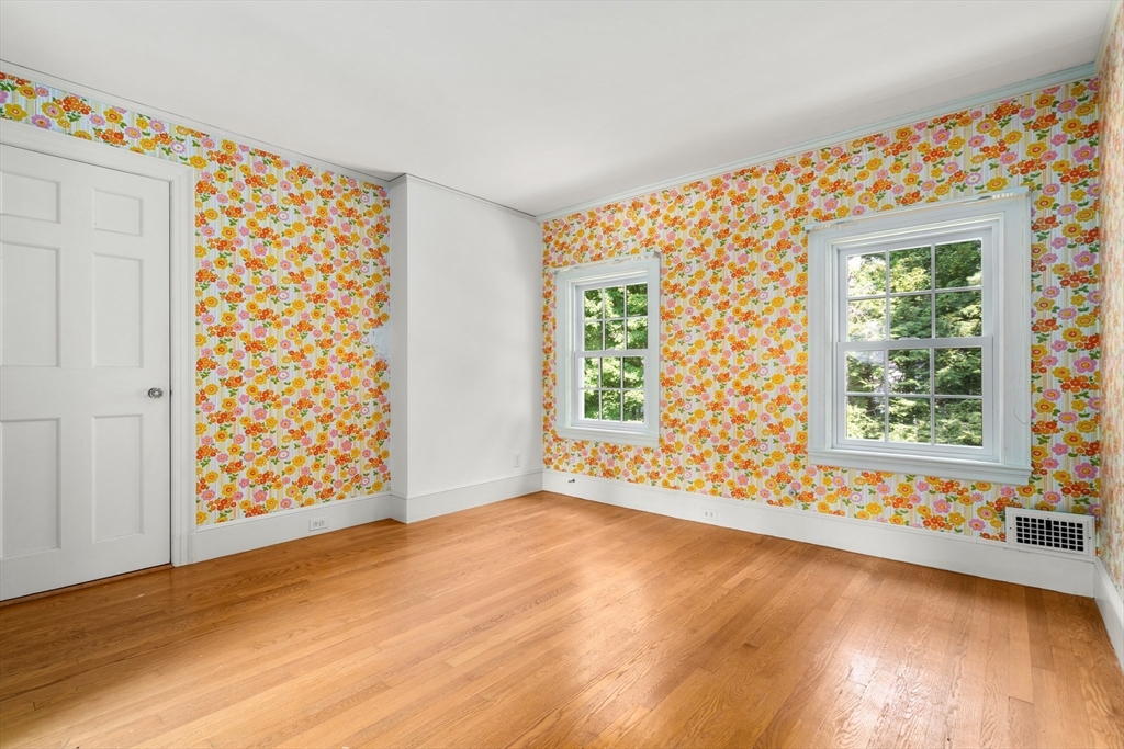 2 Kenilworth Road Wellesley, MA 02482 - Photo 29 of 41 a view of an empty room with wooden floor and a window