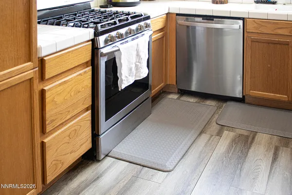 a view of washer and dryer with wooden floor