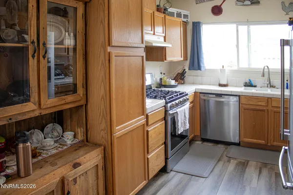 a kitchen with cabinets and window